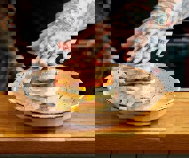 Our signature Sausage breakfast muffin. Sausage patty, melted cheese, runny fried egg and homemade hash browns