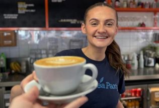 Team Handing Over Latte