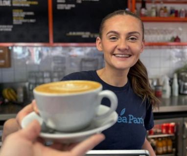 Team Handing Over Latte