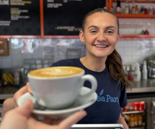 Team Handing Over Latte